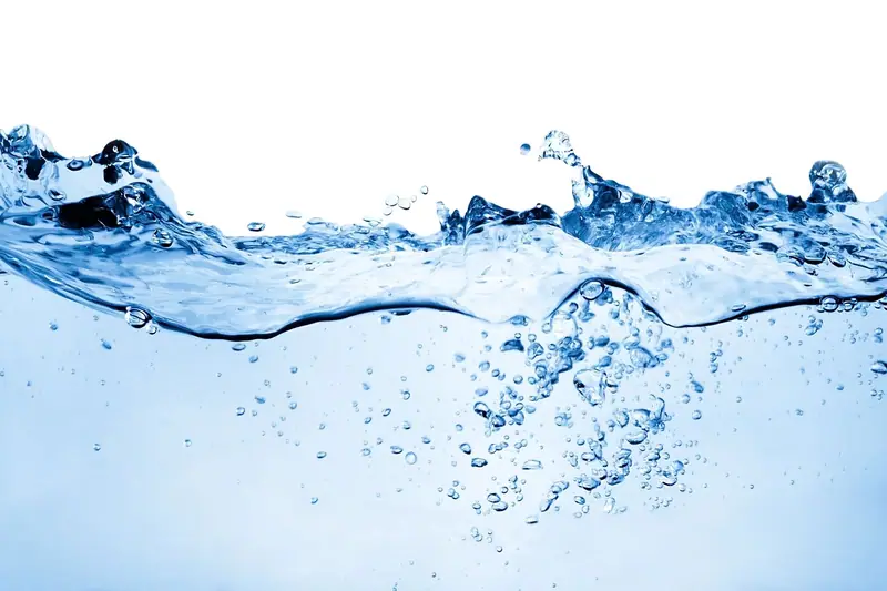 Clear blue water splashing with bubbles